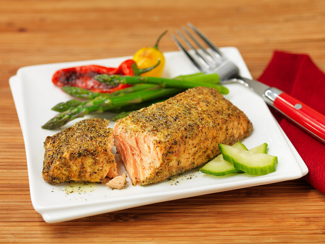 Salmon in a spice coating with vegetable garnish