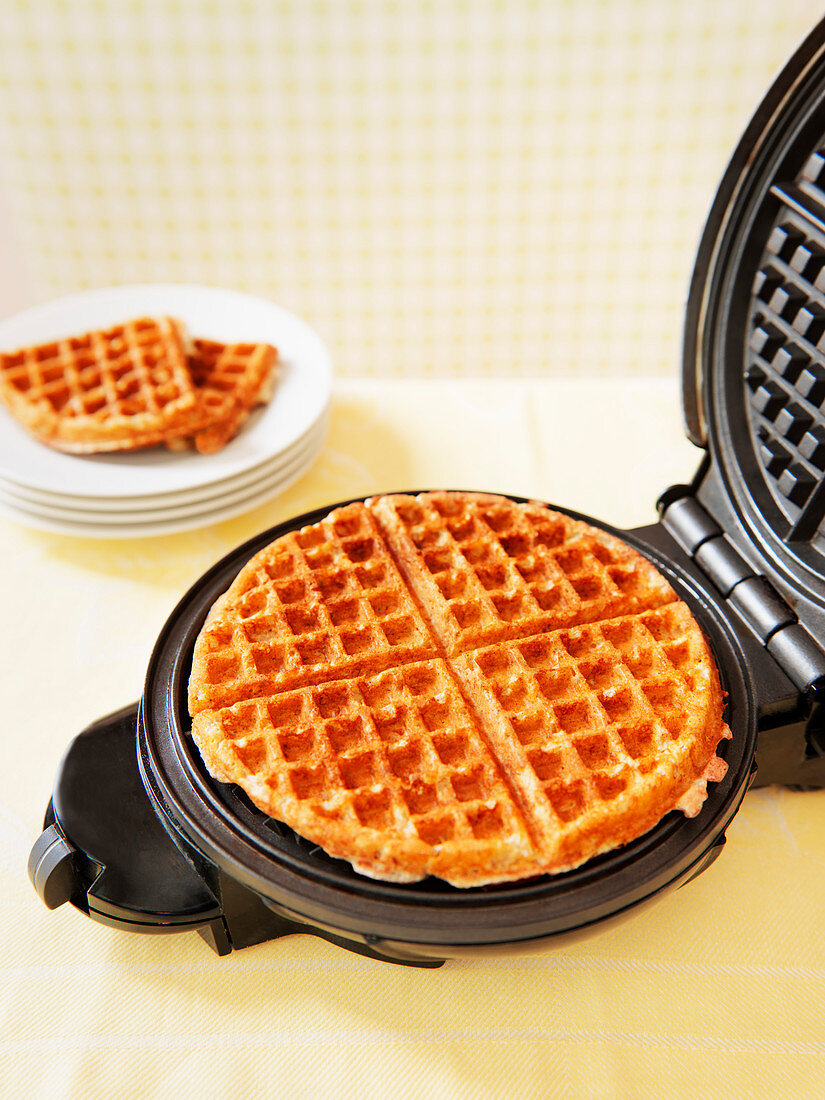 Baked waffles in a waffle iron