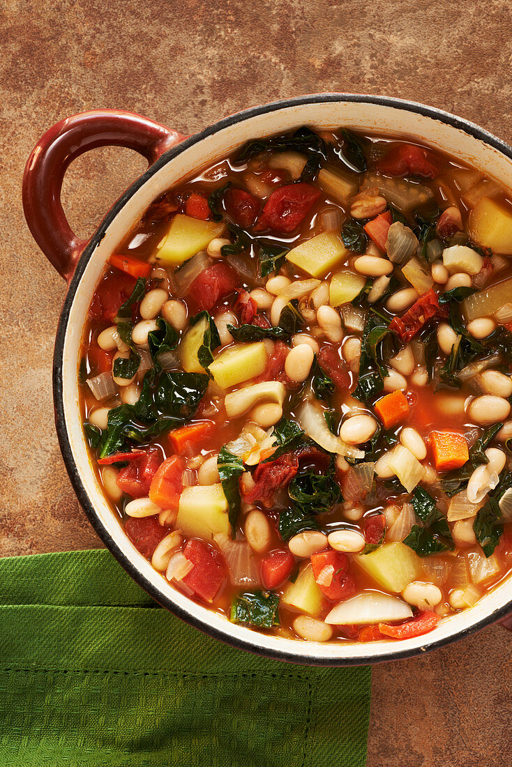 Vegetable soup with kale, white beans, potatoes, carrots and tomatoes