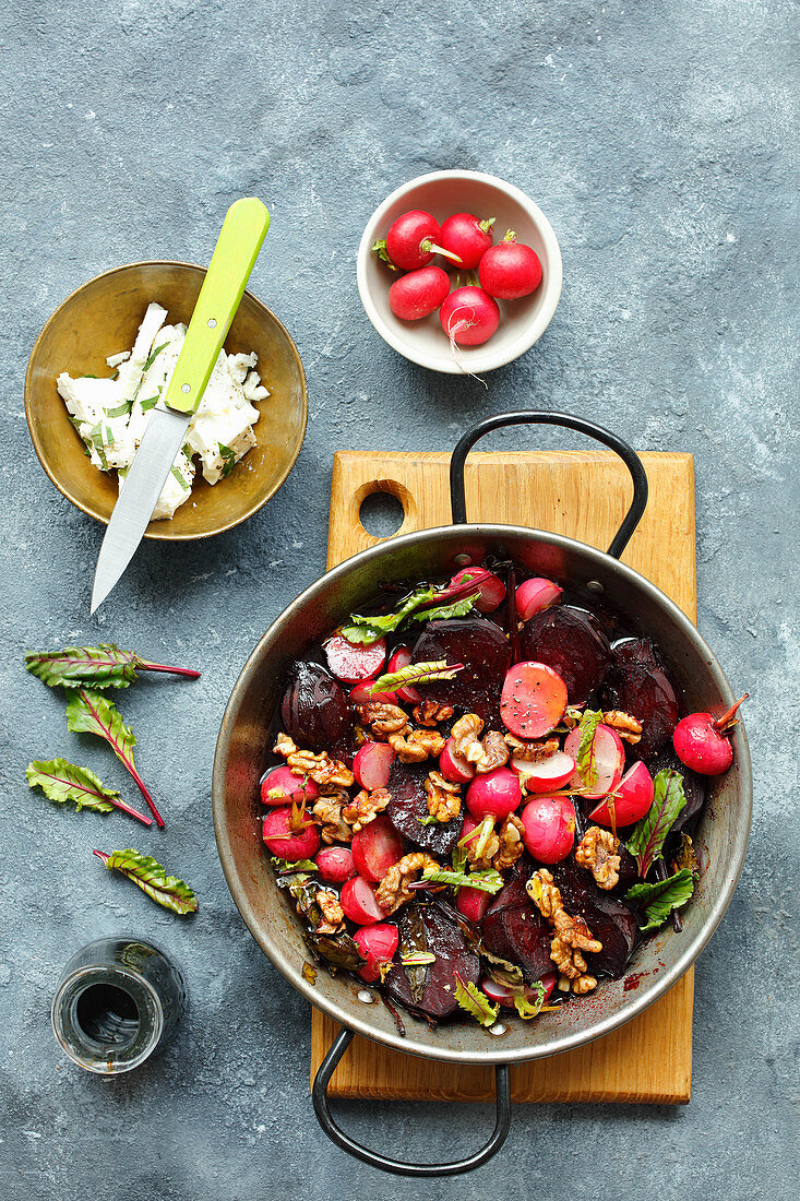 Beetrots and red radishes baked with walnuts with feta