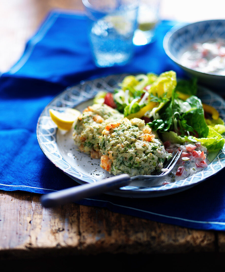 Cod cakes with tartare sauce and salad