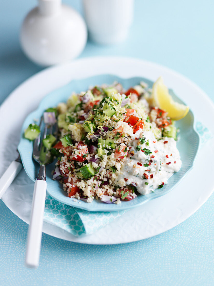 Couscous with lemon, cucumber, tomato, yogurt, onion and herbs