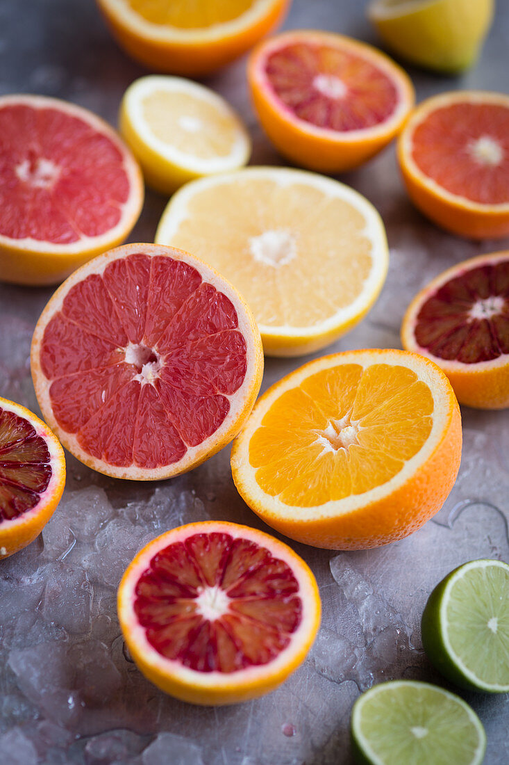 Assorted citrus fruits cut in half