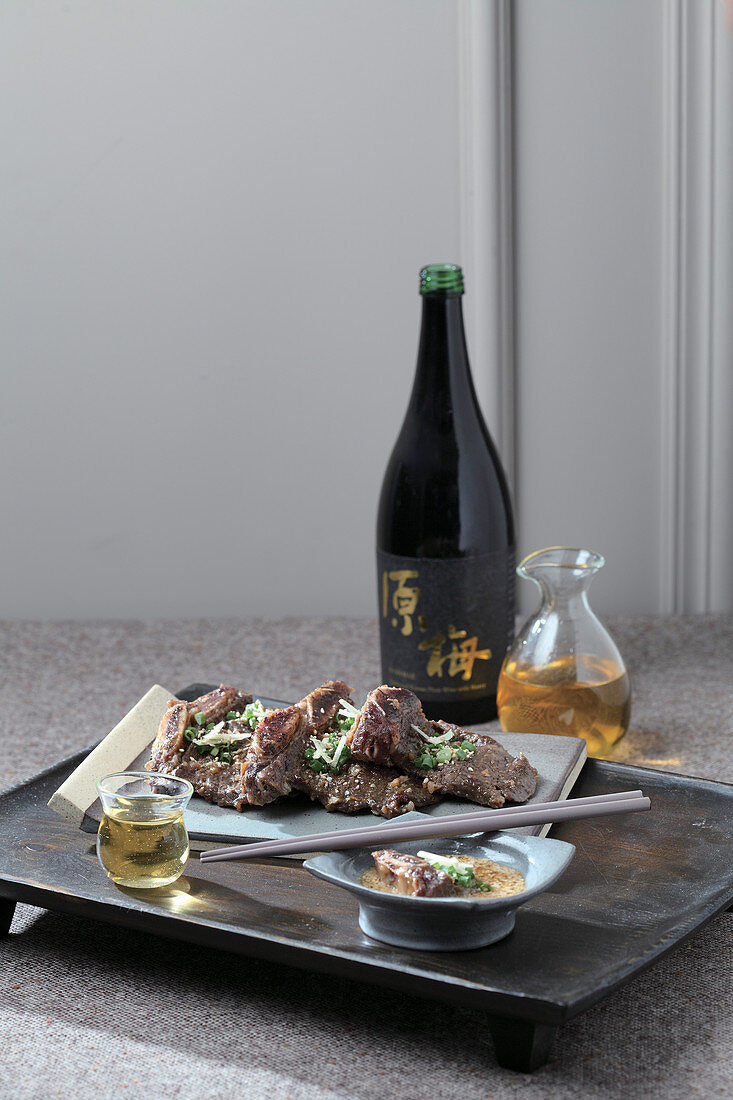 Grilled ribs with sesame sauce salad and wine (Korea)