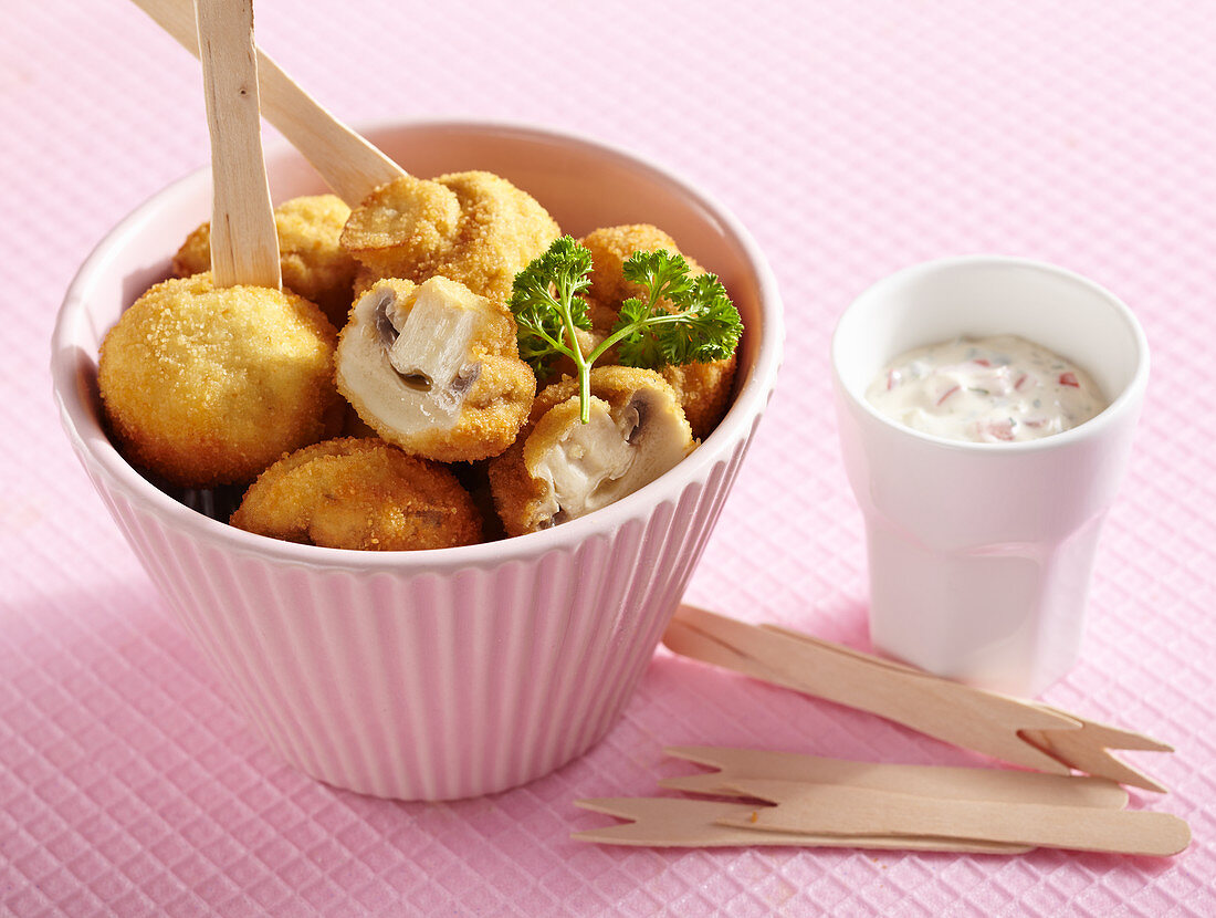 Breaded, crispy fried mushrooms with a vegetable dip made from mayonnaise and yoghurt
