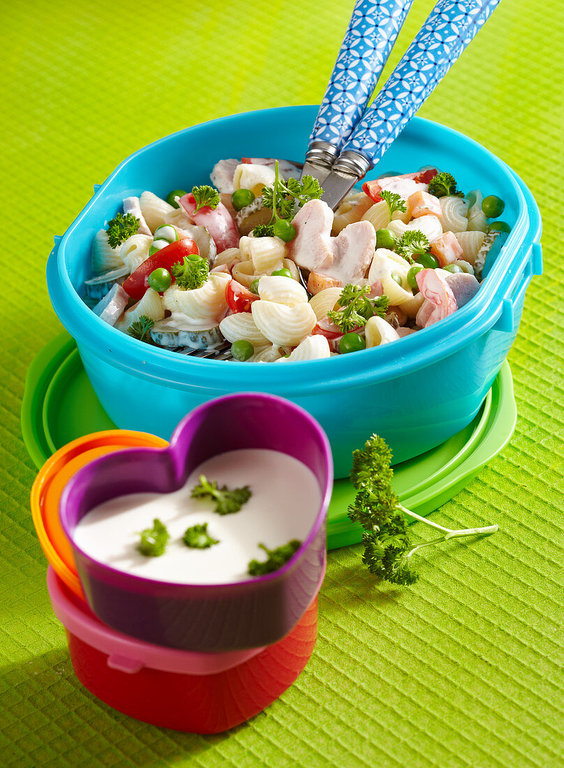 Elbow macaroni salad with heart-shaped pieces of ham and a yoghurt dressing