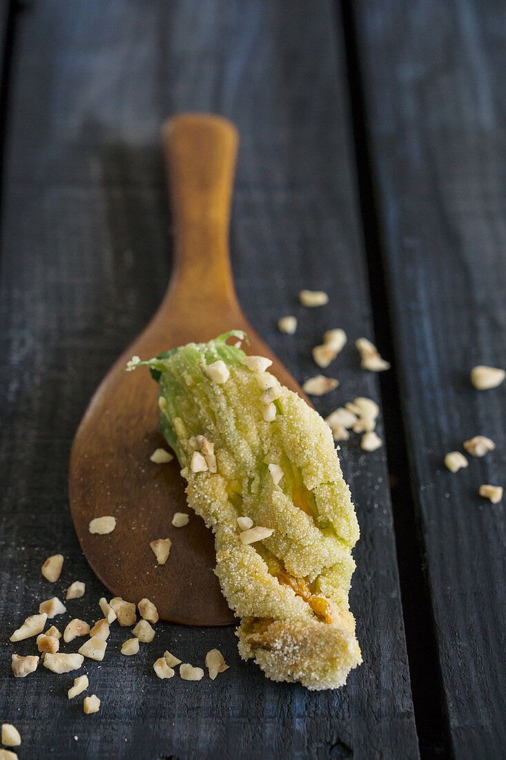 Fried courgette flowers with chopped almonds