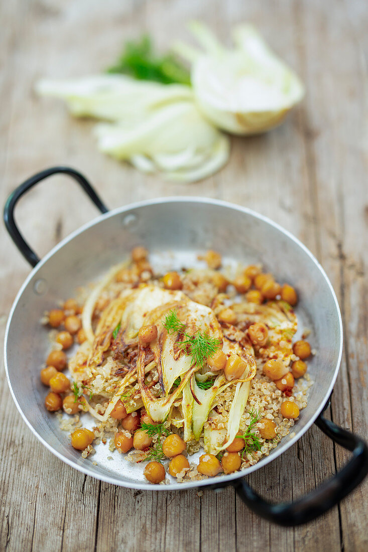 Warm fennel quinoa salad with chickpeas in a pan