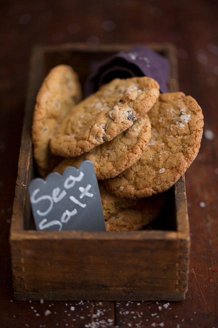 Chocolate chip cookies with sea salt in a wooden box