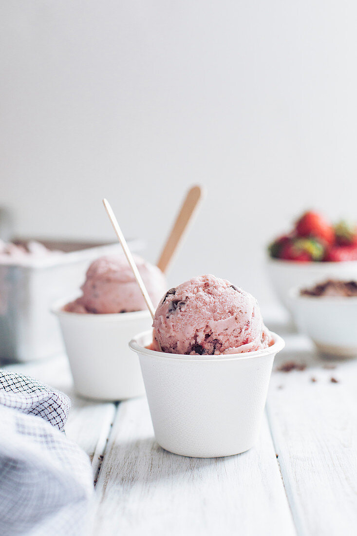 Strawberry ice cream in white cups