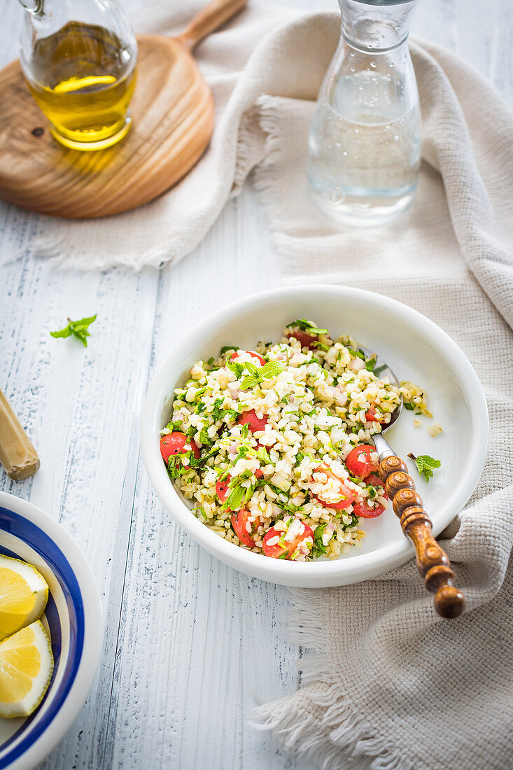 Simple lebanese salad with bulgur parsley, mint and tomatoes