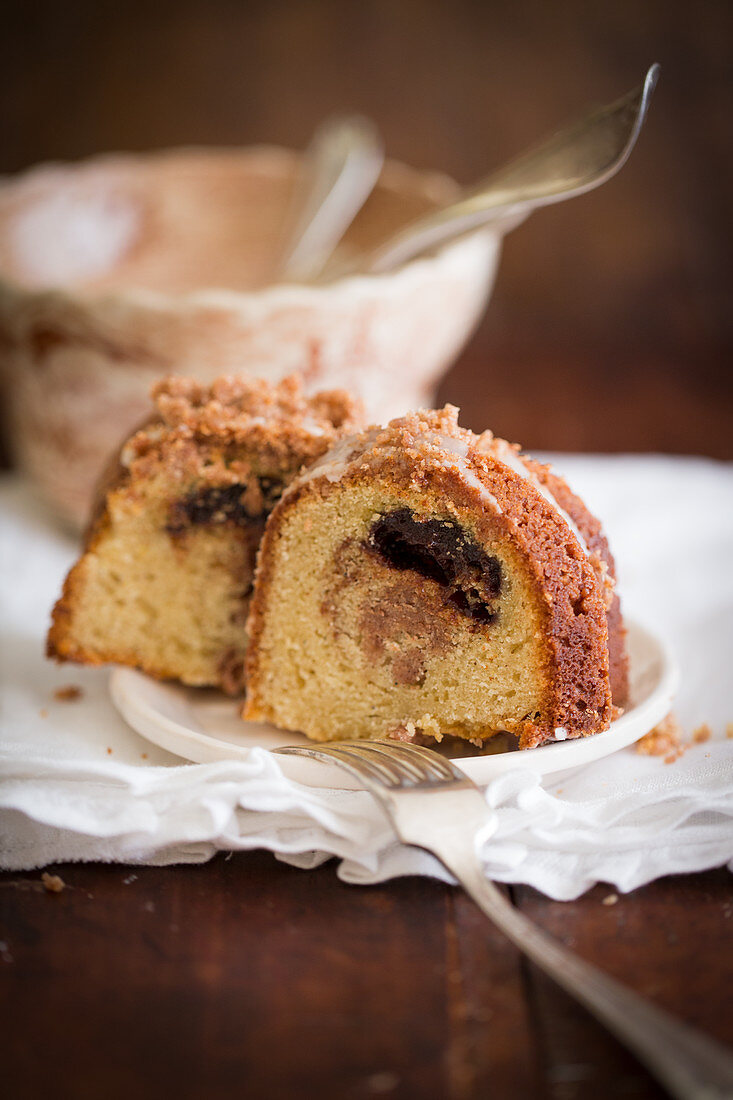 Two slices of sour cream coffee cake on a plate