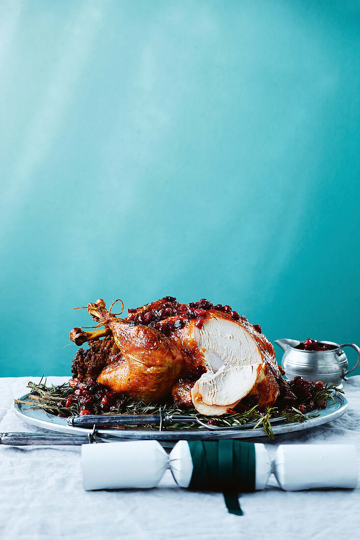 Cranberry glazed turkey with pumpkin and pecan stuffing