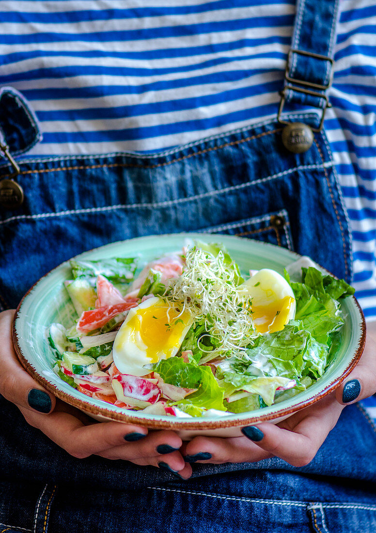 Spring salad in a hands