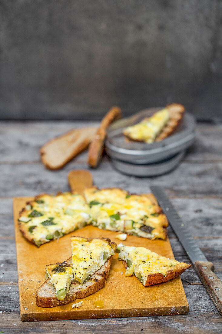 Courgette and mint frittata on grilled amaranth and rice bread