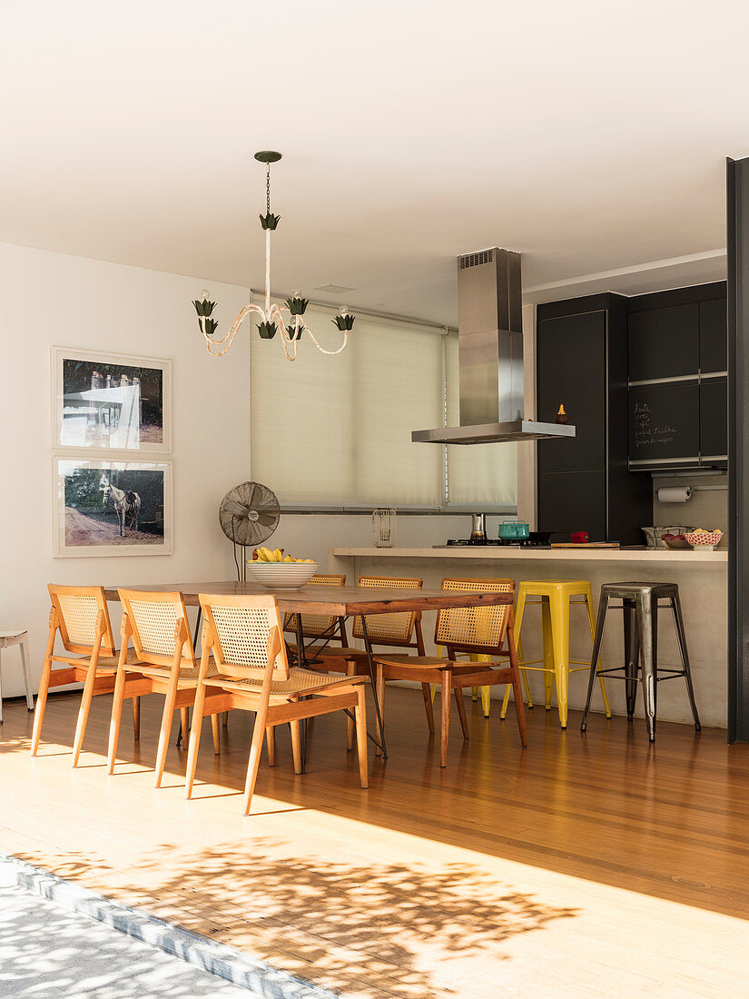 Dining table in open-plan kitchen opening straight on to terrace