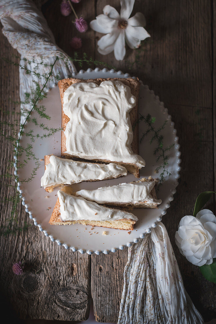 A sponge cake on a rustic kitchen table