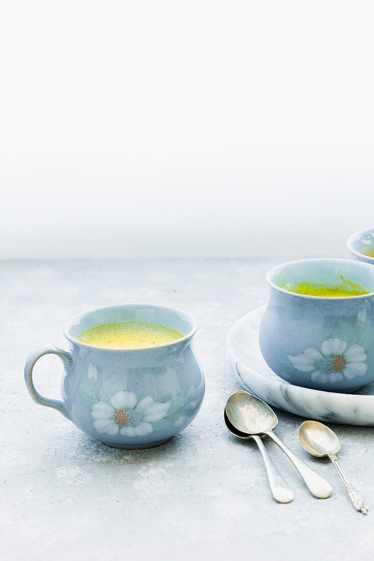 Golden Turmeric Milk served in Blue Mugs