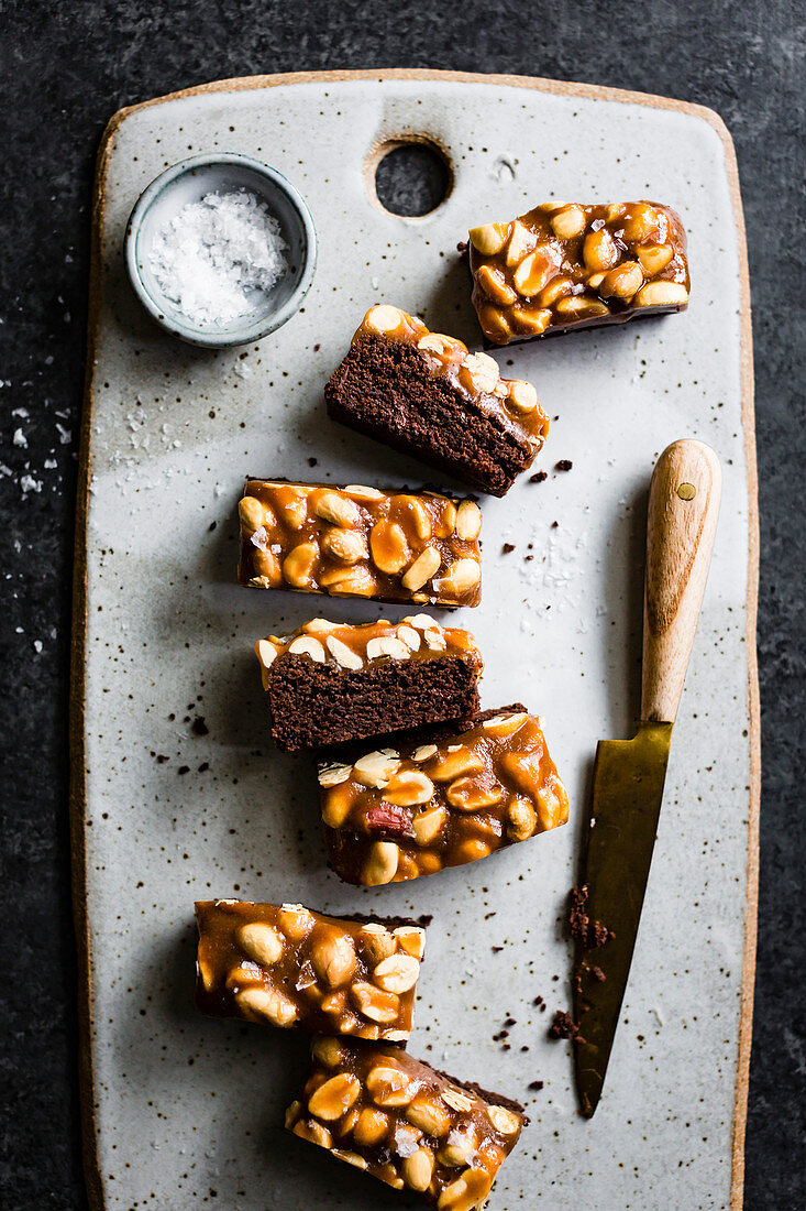 Chocolate slices with peanuts and caramel (top view)