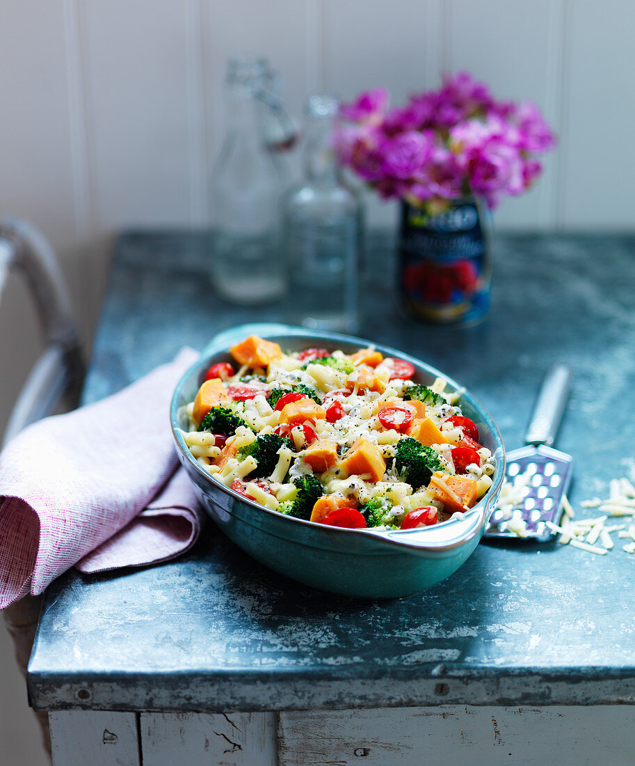 Sweet potato pasta bake with broccoli, carrots and tomatoes