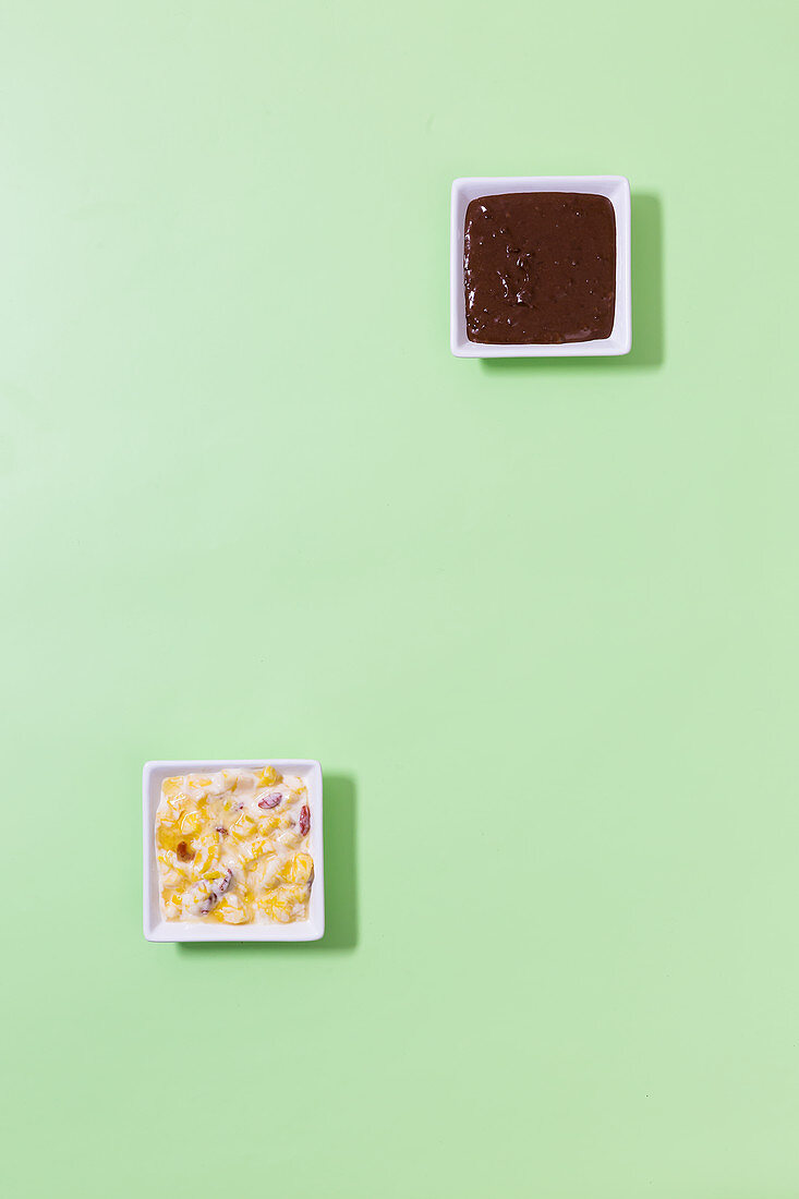 A cashew and chocolate dip and a coconut yoghurt dip