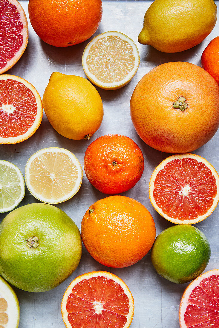 Assorted citrus fruit, whole and halved
