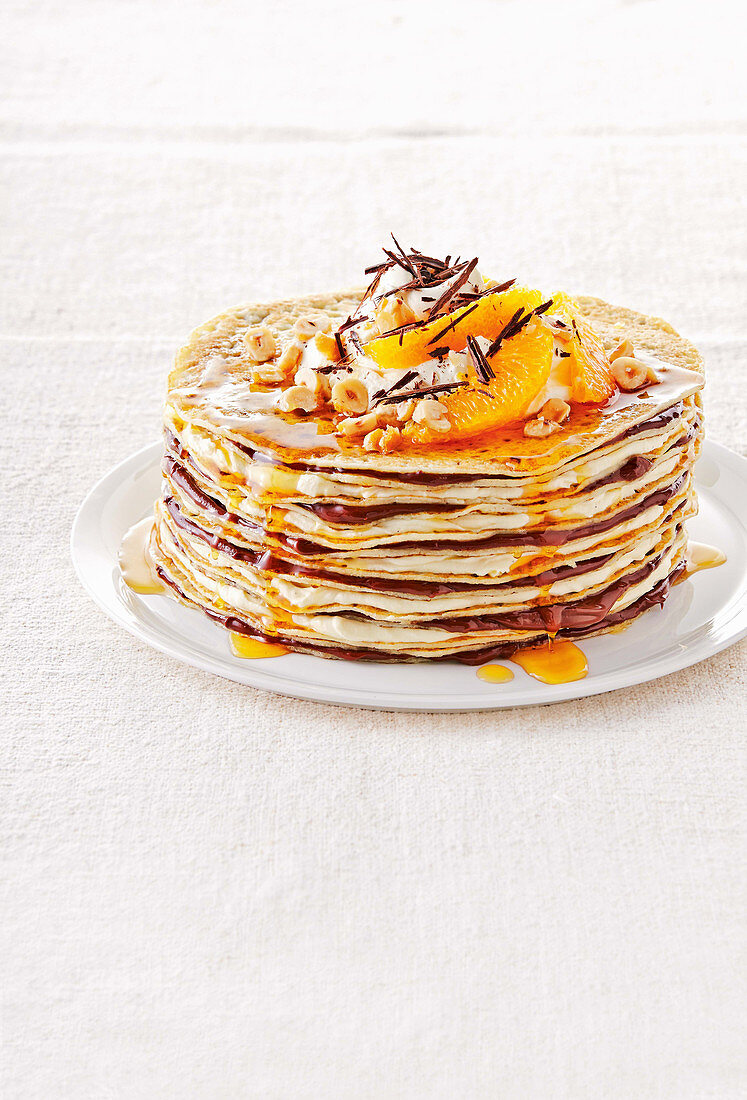 Gluten free crepes with nuts and oranges