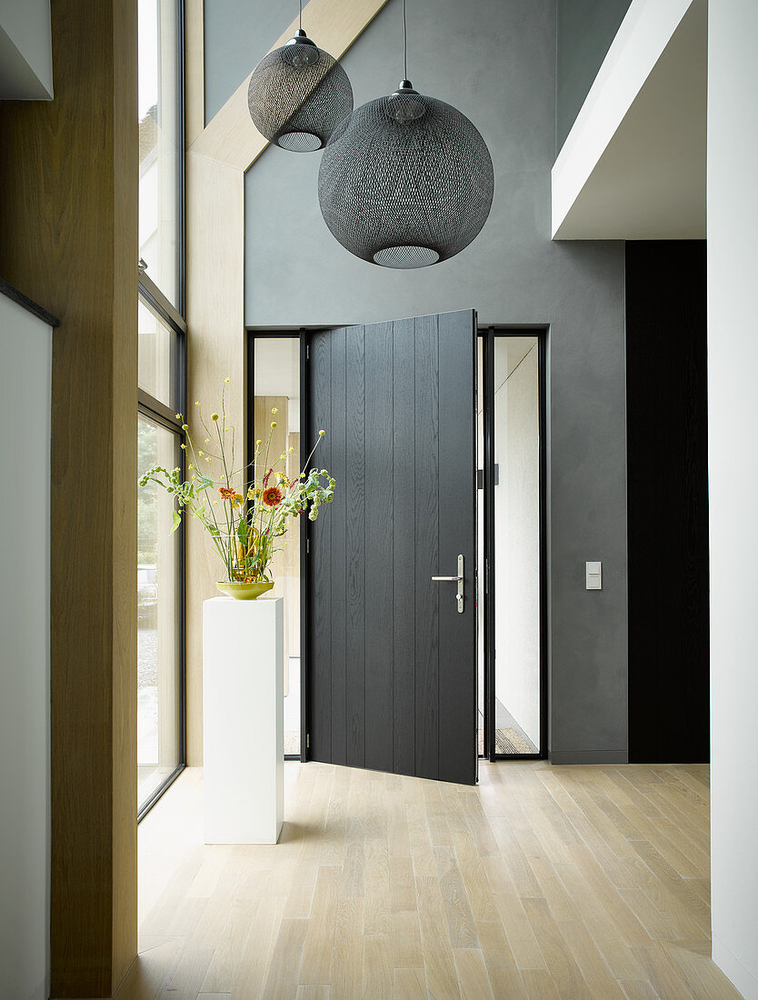 Spherical lamps in double-height foyer