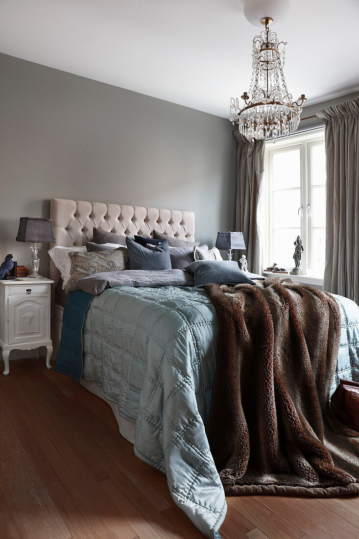 Classic bedroom in blue-grey and brown shades