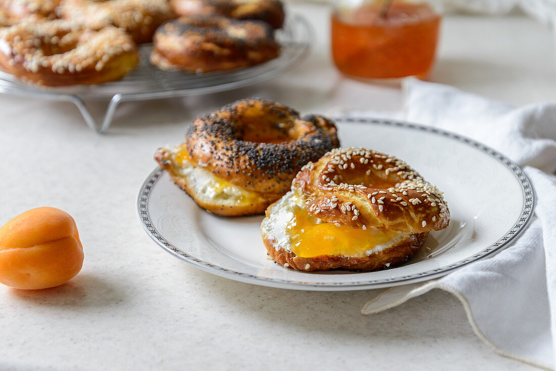 Closeup view of freshly baked bagels with apricot jam filling