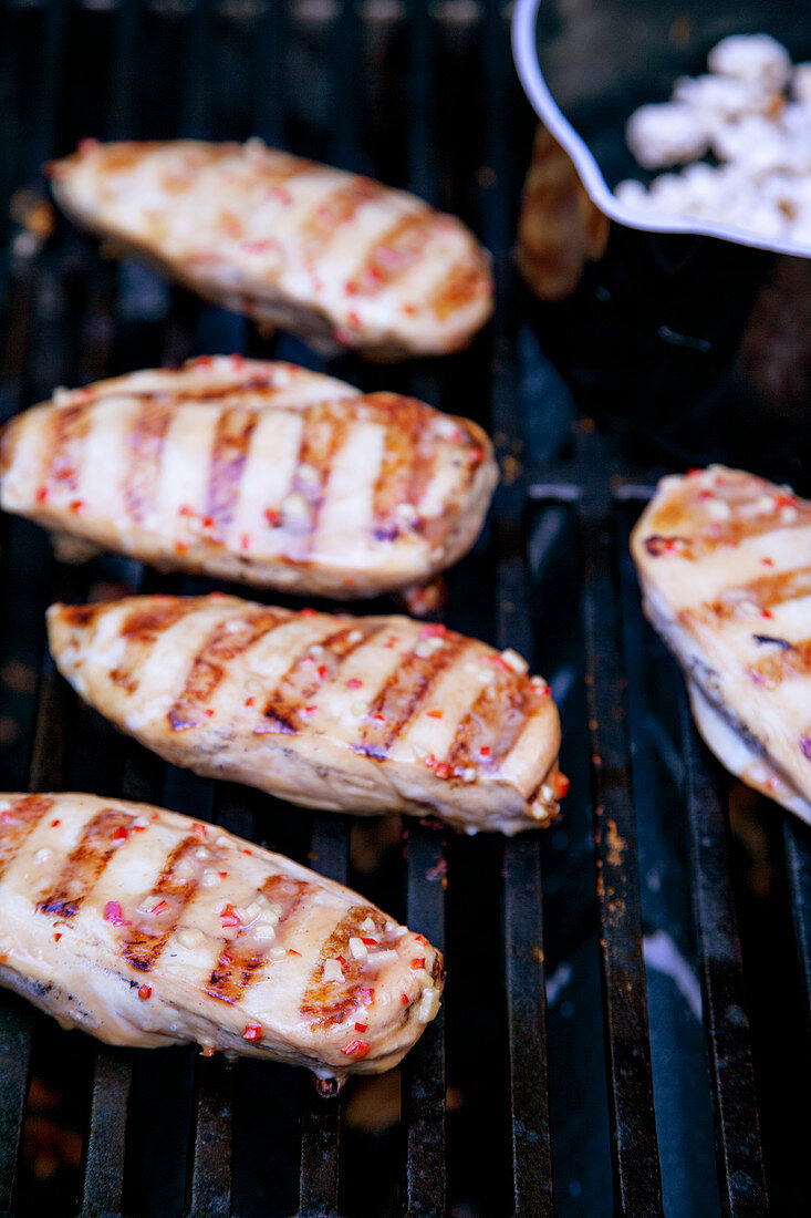 Grilled chicken breasts with peanut cream and popcorn coating