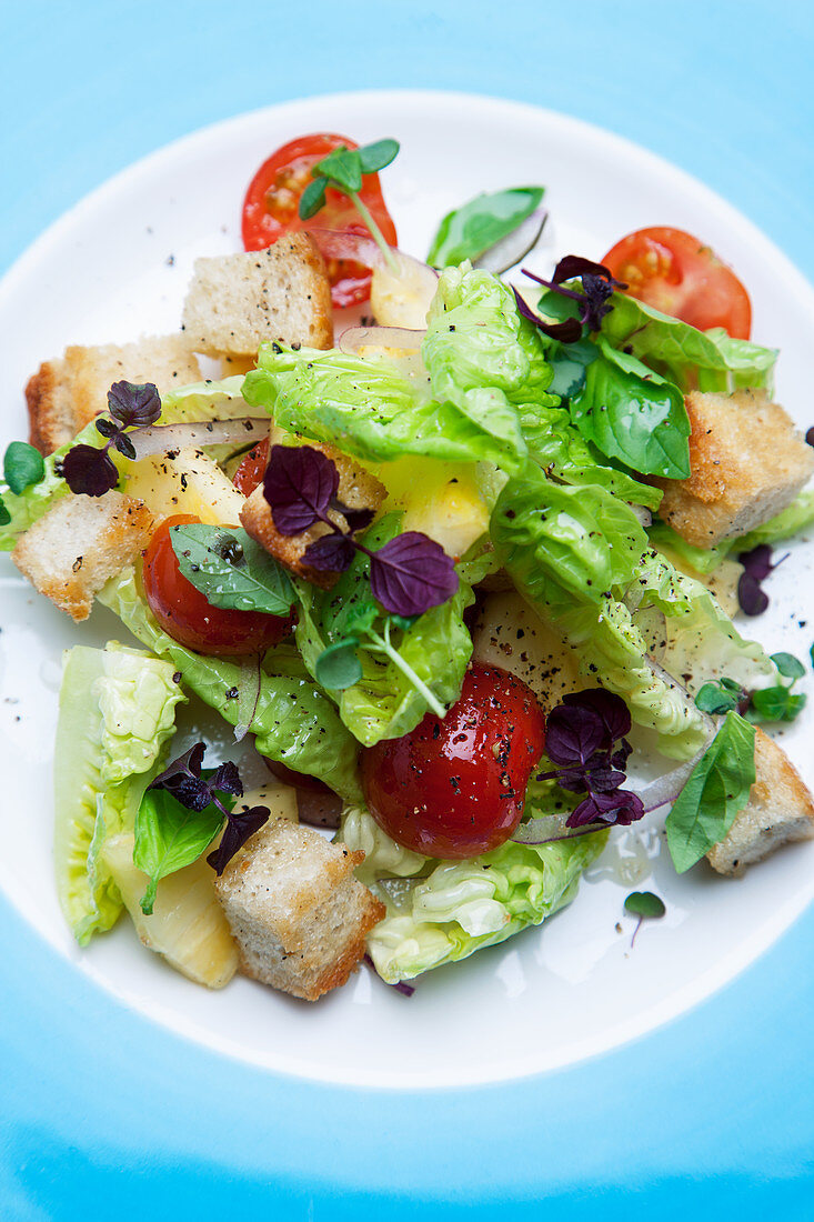 Pineapple salad with cherry tomatoes and grilled Ciabatta croutons