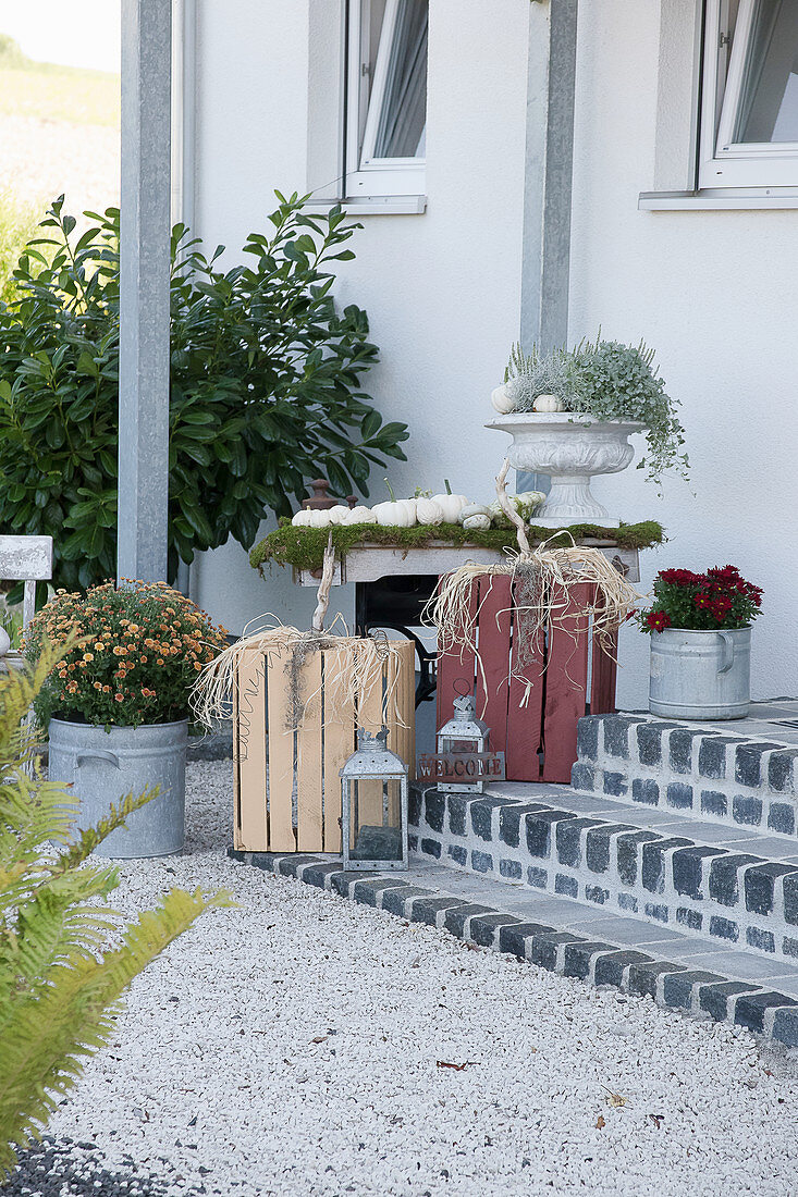 Autumnal arrangement with wooden crates made into pumpkins