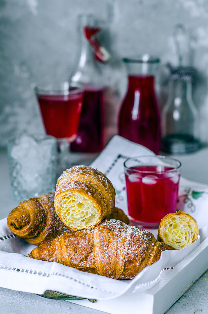 Croissants and raspberry juice