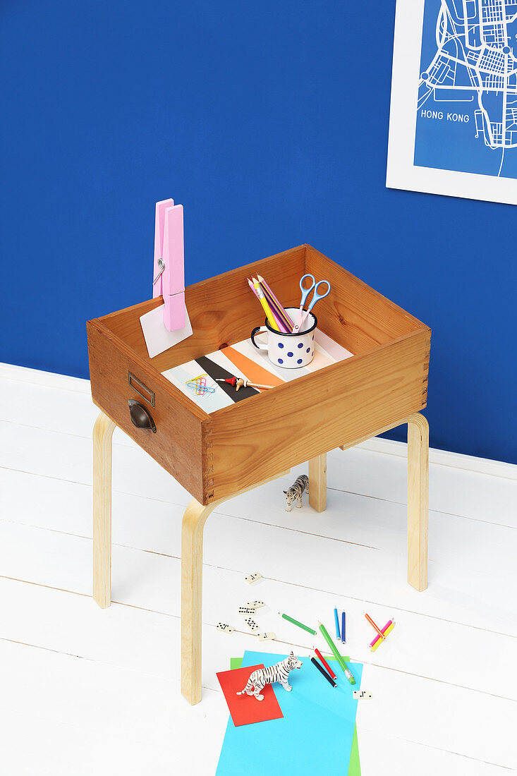 Side table made from old drawer and furniture legs