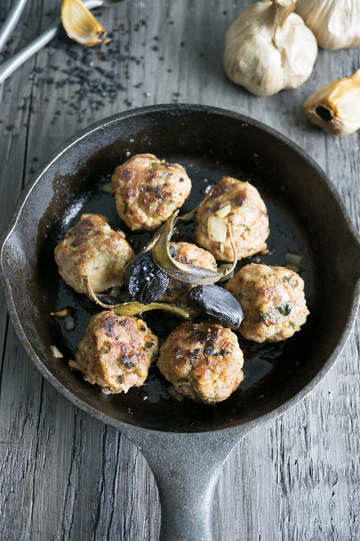 Meatballs with black garlic and sage