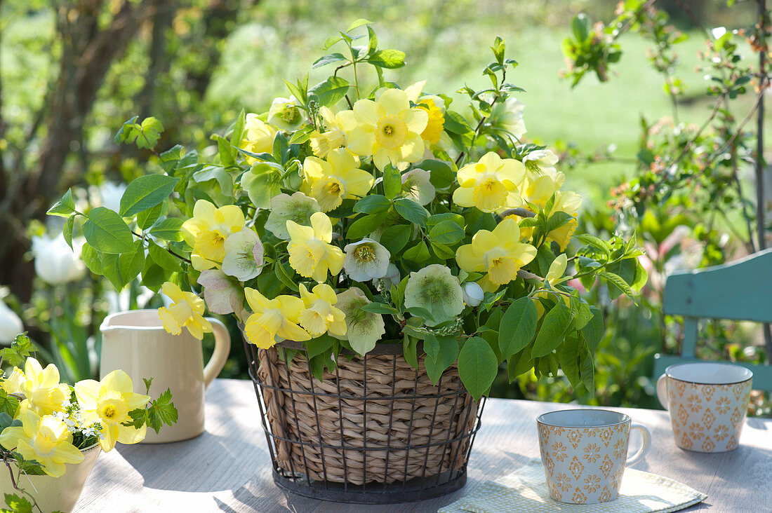 Bouquet of daffodils and spring roses in a basket