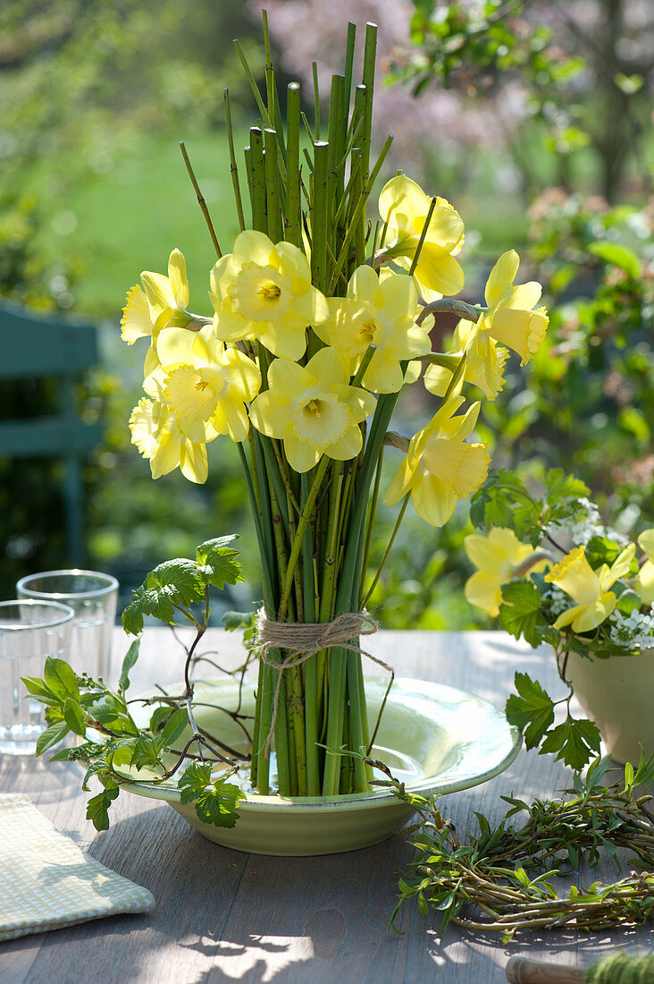A bouquet of daffodils in a bowl