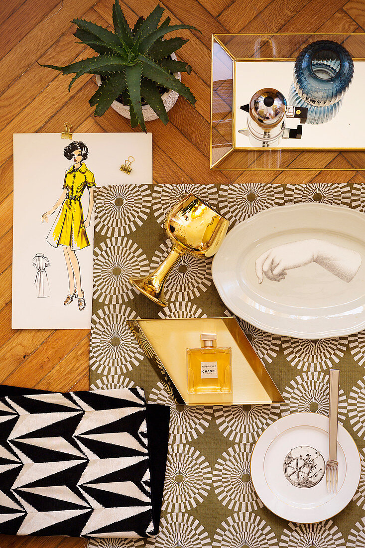 Mood board with plates, goblet and perfume bottle