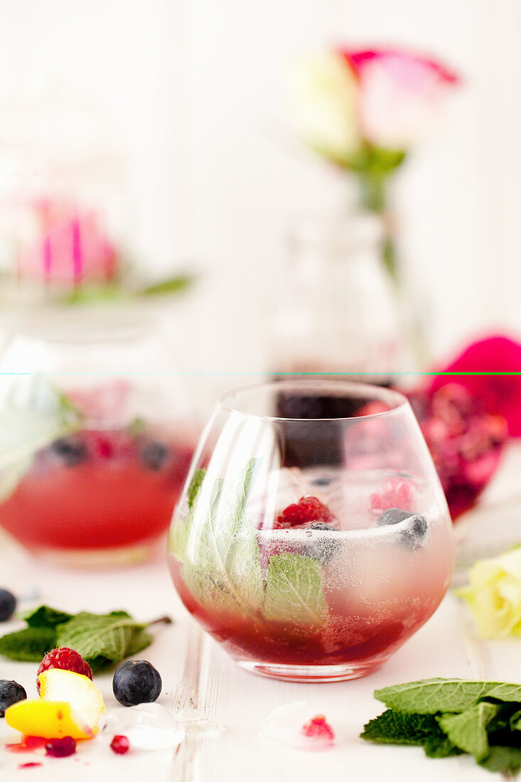 Grenadine topped with sparkling cloudy lemonade with mint and raspberries