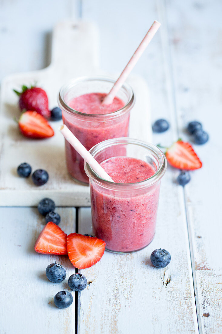 Two berry smoothies in glasses