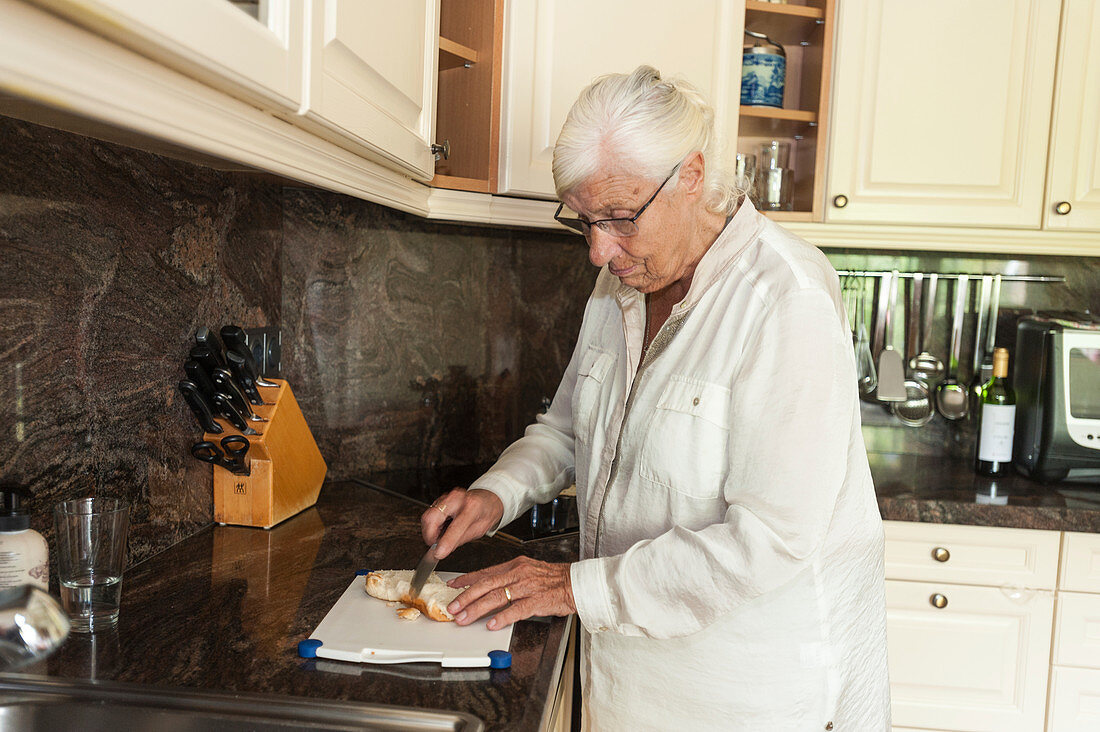 Older woman preparing food