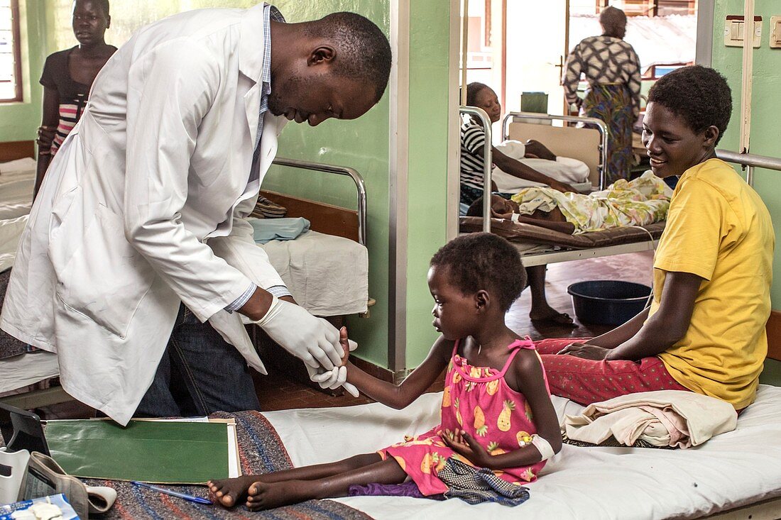Doctor examining a young girl