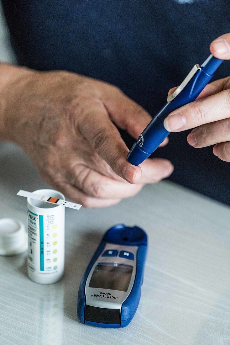 Diabetic woman checking her blood sugar level
