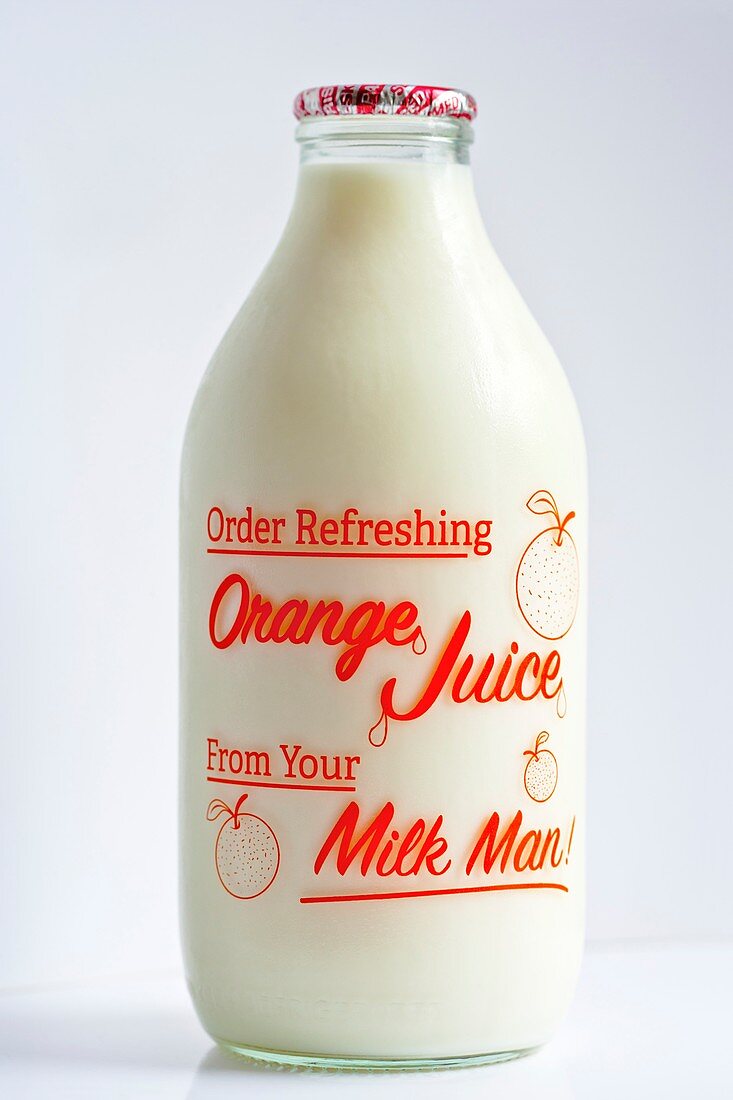Bottle of semi-skimmed milk advertising fresh orange juice