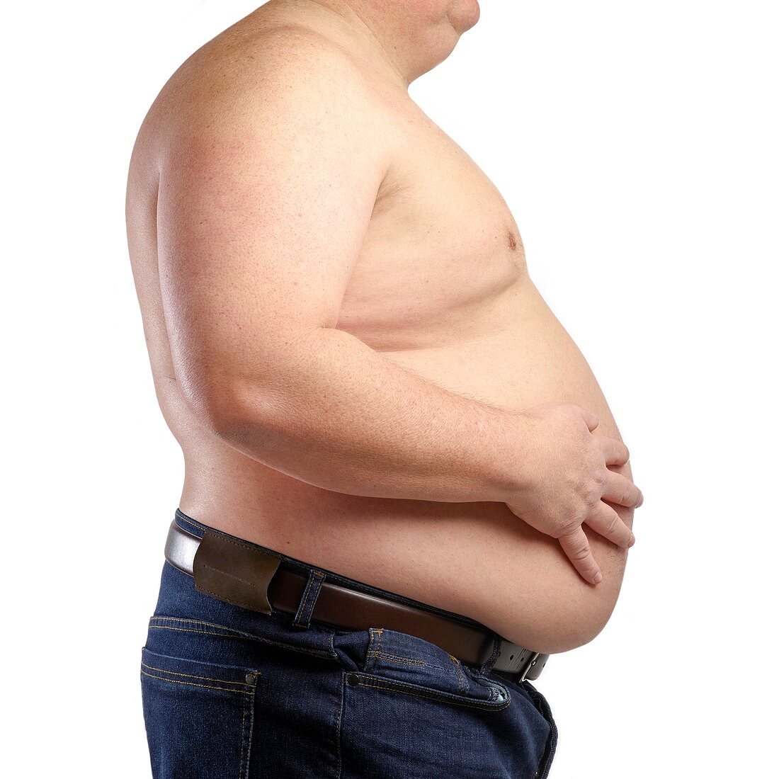 Overweight man touching stomach