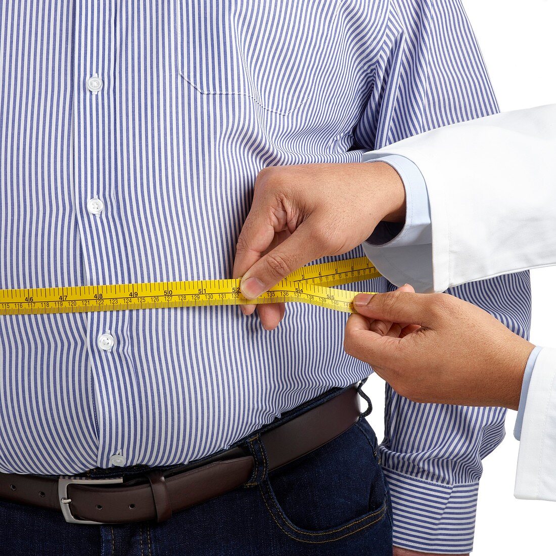 Doctor measuring man's waist
