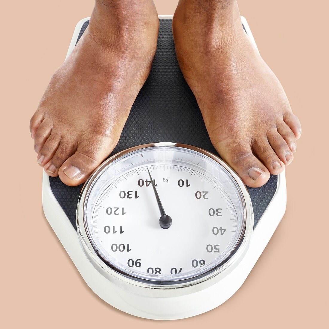 Man standing on weighing scales