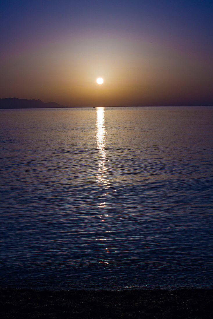 Sunset over calm sea
