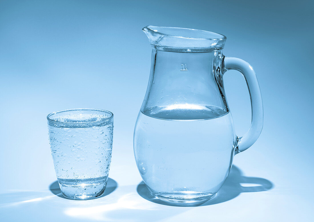Jug and glass with drinking water